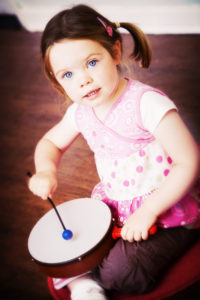 Girl playing drum